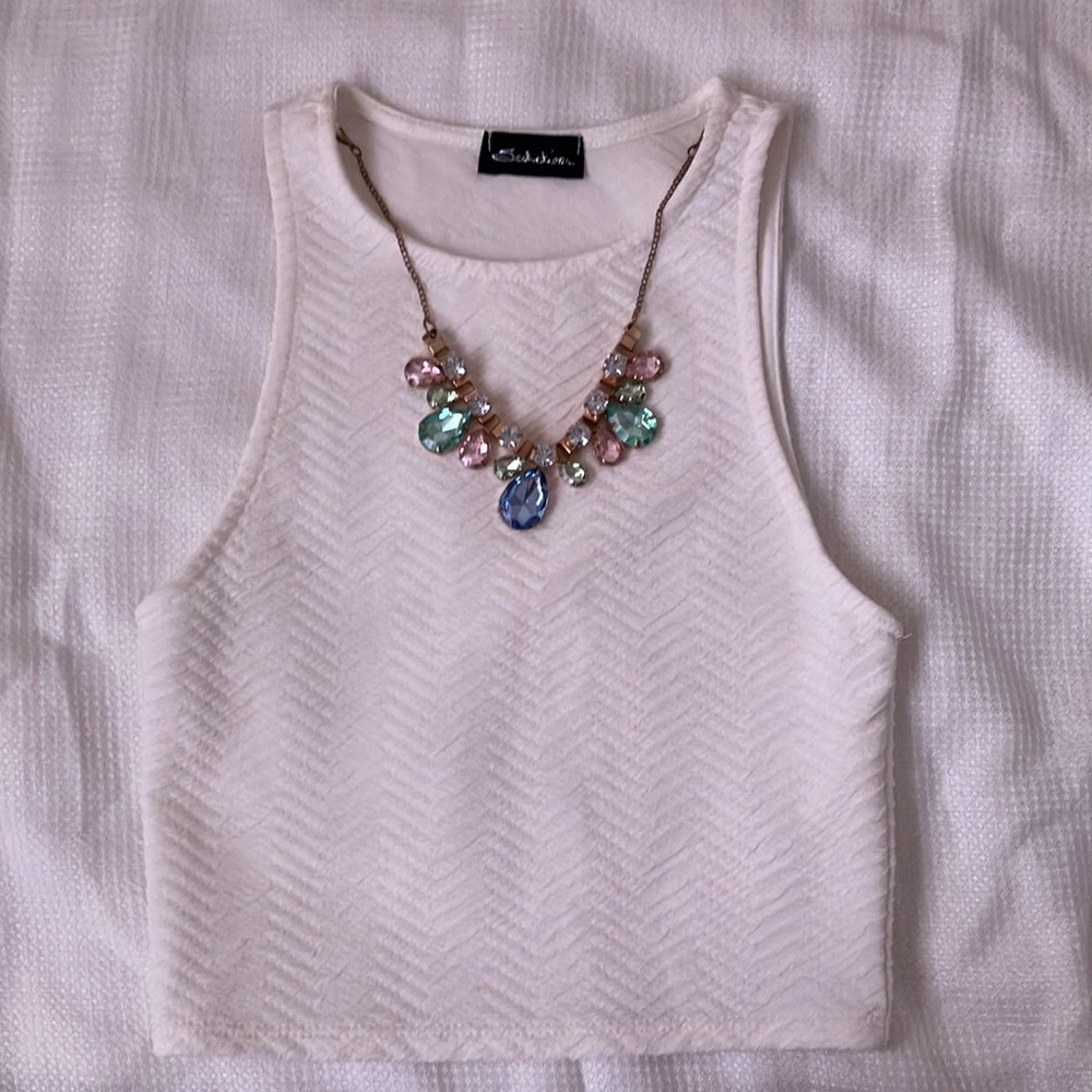 White sleeveless cropped top with detachable necklace embellishment